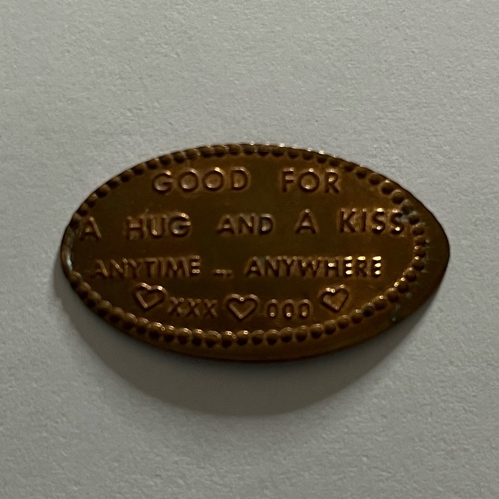 Elongated coin/ Squished Penny -- "Good for a hug and a kiss anytime... anywhere